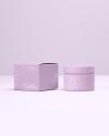 Jar and box packaging designs for the Covey “Last But Not Least” moisturizer in studio lighting on purple background