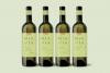 Mia Via White Wine Packaging Design mockup featuring four bottles of wine lined up on a green background