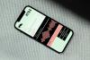 Myra Smart Radio Application screen on an iPhone model laid flat on a textured background in shades of light green