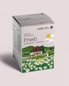 Packaging box for the German tea company Pure Tea showing an illustration of an alpine pasture with chamomile flowers and a mountain cabin.